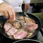 Chef preparing unique holiday game meats dishes