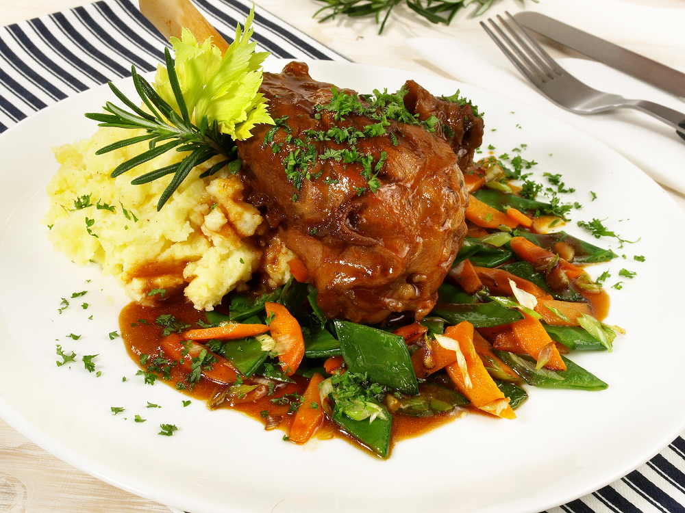 Chef preparing a holiday lamb dish - Lamb Menu Ideas for Holidays