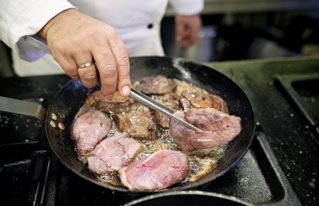 Chef preparing unique holiday game meats dishes